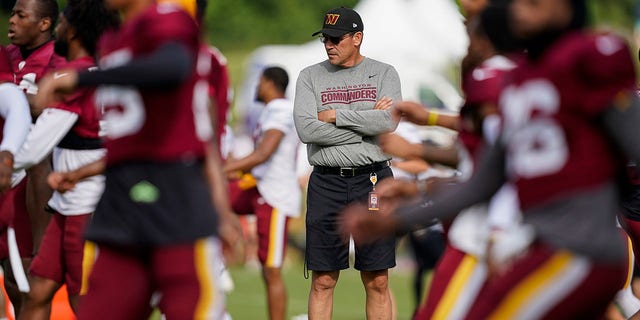 Washington Commanders head coach Ron Rivera watches his team practice at their training facility, Aug. 5, 2022, in Ashburn, Virginia.