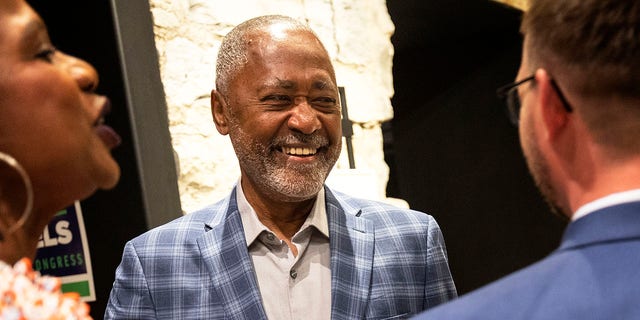 Minnesota 5th Congressional District candidate Don Samuels, center, is greeted by supporters at his primary election night watch party, Tuesday, Aug. 9, 2022, at Canopy by Hilton Minneapolis Mill District in Minneapolis.