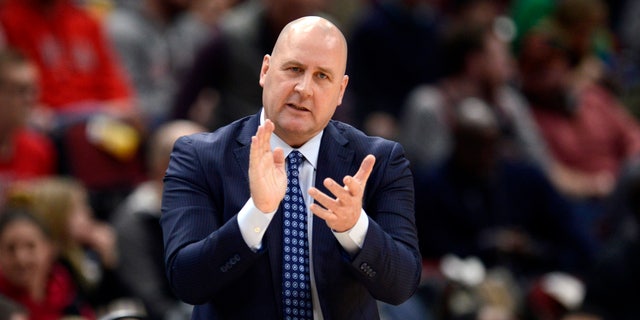 Former Chicago Bulls coach Jim Boylen cheers on players during the first half of the team's NBA basketball game against the Cleveland Cavaliers in Chicago. Boylen will remain as coach for USA Basketball for the next window of World Cup qualifying, coming up later this month with games against Uruguay and Colombia.