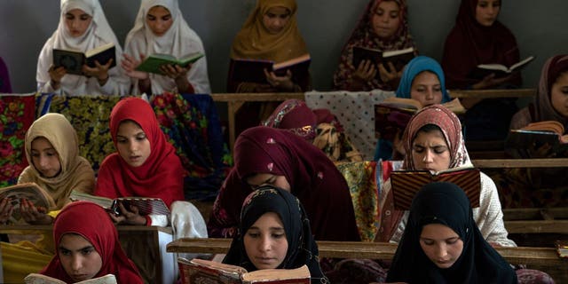 Afghan girls read the Quran in the Noor Mosque outside the city of Kabul, Afghanistan, Wednesday, Aug 3, 2022. Maulvi Bakhtullah, the head of the mosque, said that the number of girls who come to this mosque to learn Quran has multiplied after the closure of public schools. 