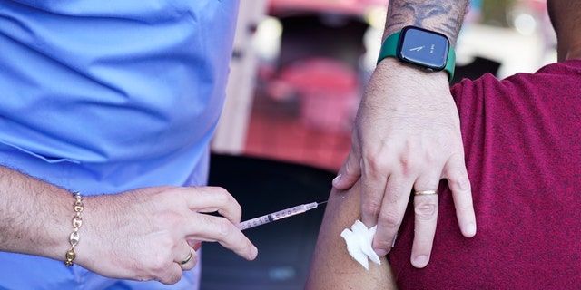 A nurse administers a monkeypox vaccine at a walk-in clinic at the North Jersey Community Research Initiative in Newark, N.J.