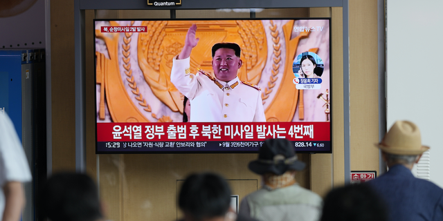 FILE - A TV screen showing a news program reporting about North Korea's missile launch with a file footage of North Korean leader Kim Jong Un, is seen at the Seoul Railway Station in Seoul, South Korea, Wednesday, Aug. 17, 2022.  (AP Photo/Lee Jin-man, File)