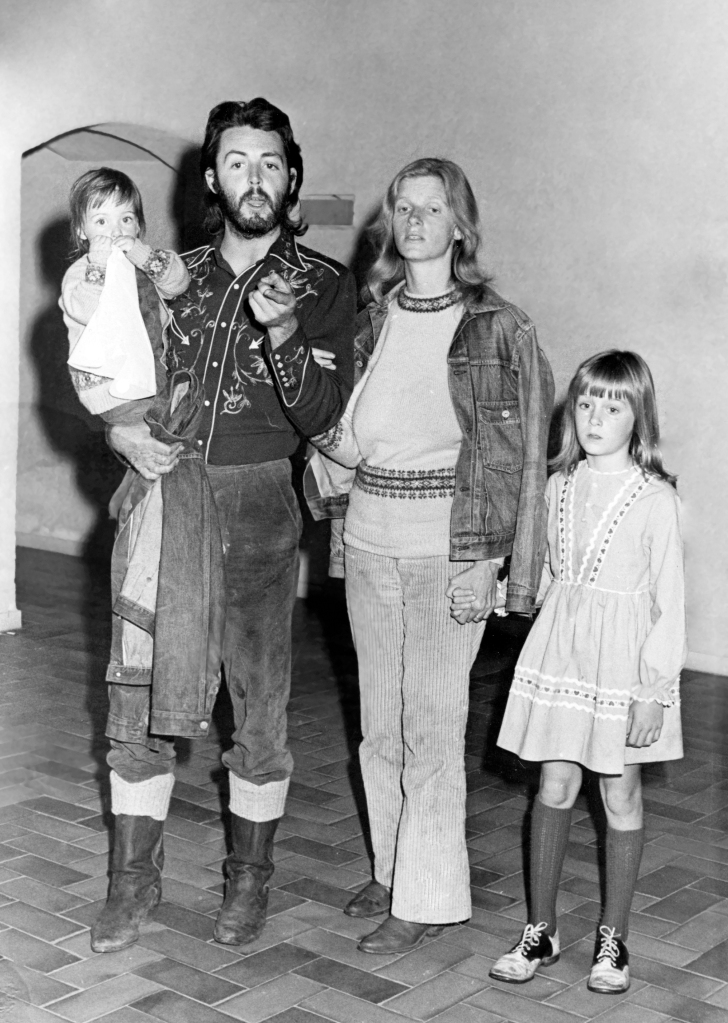 Paul McCartney poses with his wife Linda and their children Mary and Heather are pictured in 1971.