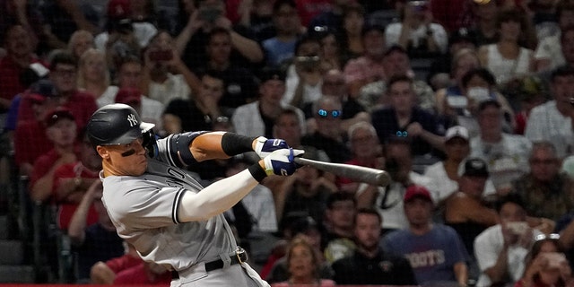 New York Yankees' Aaron Judge hits a three-run home run during the fourth inning of a baseball game against the Los Angeles Angels Tuesday, Aug. 30, 2022, in Anaheim, California.