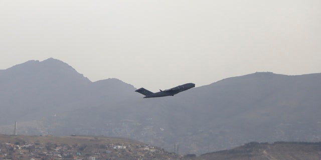 A U.S military aircraft takes off from the Hamid Karzai International Airport in Kabul, Afghanistan.