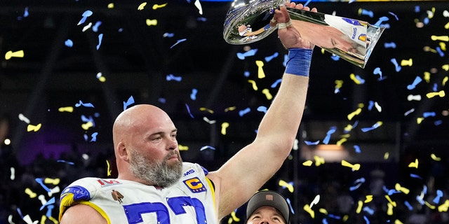 Andrew Whitworth of the Los Angeles Rams holds up the Lombardi trophy after the Rams defeated the Cincinnati Bengals in Super Bowl LVI at SoFi Stadium in Inglewood, California, on Feb. 13, 2022.