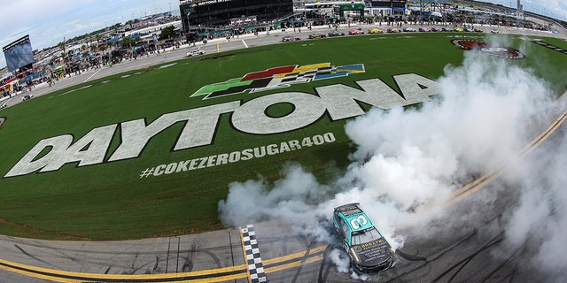 Austin Dillon, driver of the No. 3 Breztri Chevrolet, celebrates with a burnout after winning the Coke Zero Sugar 400 at Daytona International Speedway in Daytona Beach, Florida, on Aug. 28, 2022.