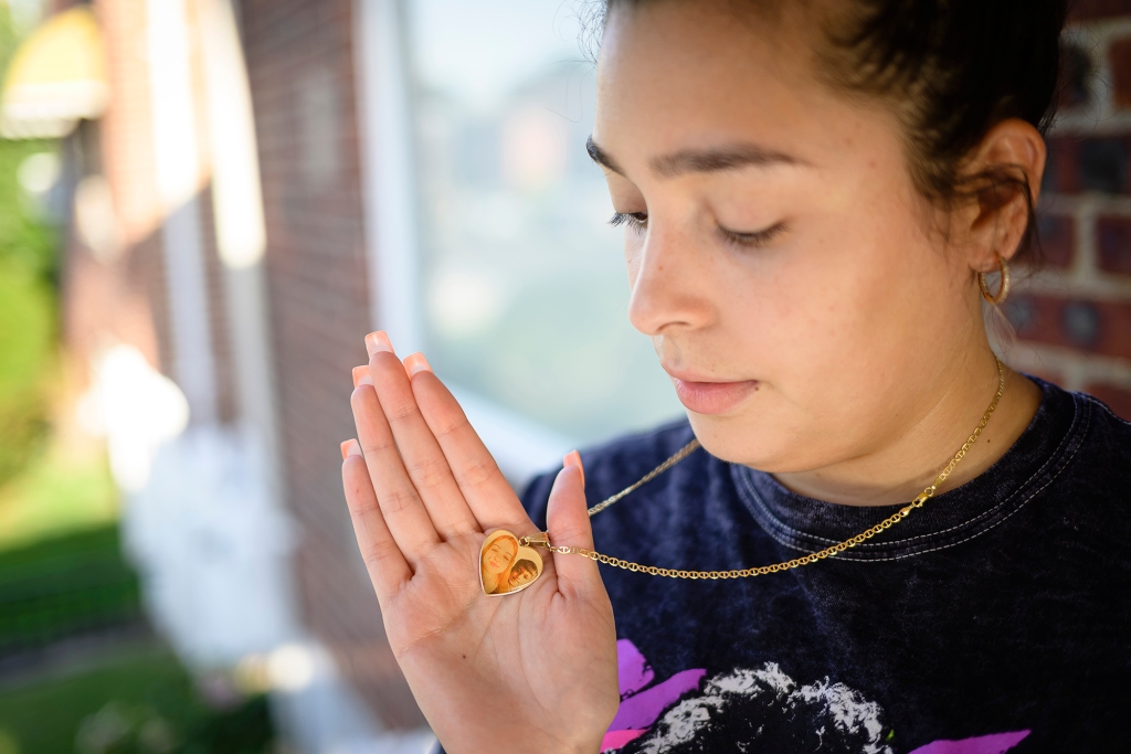 Aliyah Santana wears a heart around her neck with a photo of her late sister, Samantha Santana.