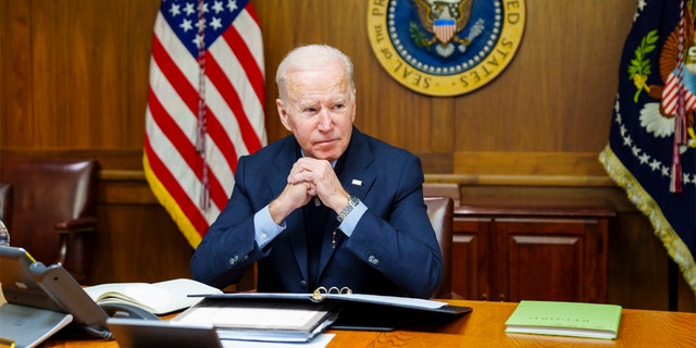 President Biden is seen at Camp David in Maryland during a phone call with Russian President Vladimir Putin on Feb. 12, 2022.