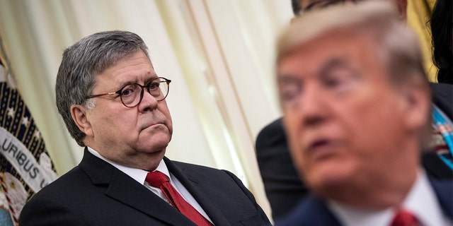 Then-Attorney General Bill Barr, shown at left, and then-Deputy Attorney General Rod Rosenstein, not shown, concluded that evidence from the Mueller case was "not sufficient to establish that the President committed an obstruction-of-justice offense."