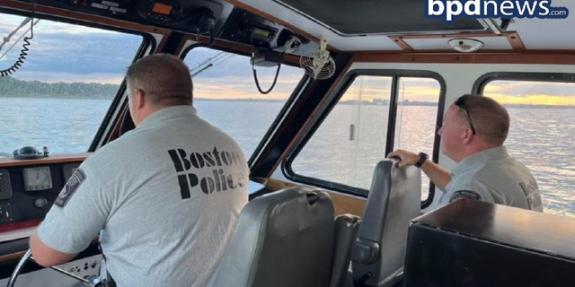 The Boston Police Department's Harbor Patrol Unit is seen transporting the groom and others to the ceremony on Saturday, Aug. 13, on Thompson Island.