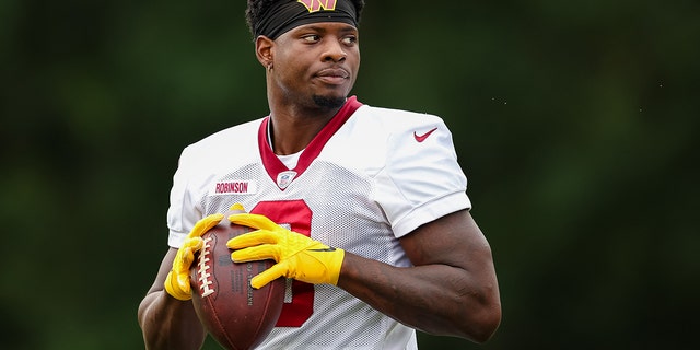 Brian Robinson of the Washington Commanders participates in a drill during training camp at Inova Sports Performance Center in Ashburn, Virginia, on Aug. 17, 2022.