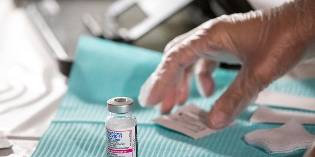 A healthcare worker prepares a dose of the Moderna COVID-19 at the Brooklyn Children's Museum vaccination site, serving children six months to 5-years old, in the Brooklyn borough of New York, on Thursday, June 23, 2022. 