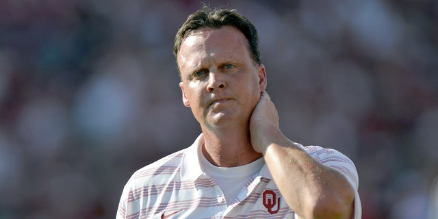 Running backs coach Cale Gundy of the Oklahoma Sooners walks the field prior to kickoff of their game against the Louisiana Tech Bulldogs at Gaylord Family Oklahoma Memorial Stadium on Aug. 30, 2014 in Norman, Oklahoma.