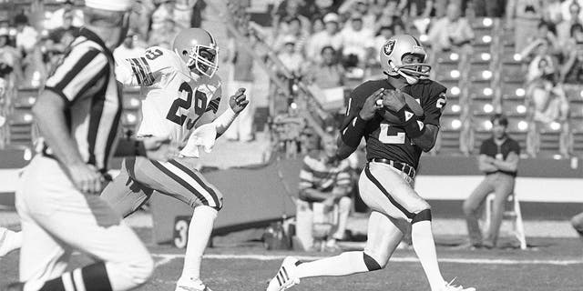 Los Angeles Raiders wide receiver Cliff Branch, right, catches a pass from quarterback Jim Plunkett for a 64-yard gain as Cleveland Browns' Hanford Dixon defends during the first quarter of an NFL football playoff game in Los Angeles, on Jan. 8, 1983. Branch was one of the best deep threats of his era to earn a spot in the Pro Football Hall of Fame. 