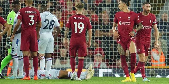 Liverpool's Darwin Nunez, second right, gestures after he was issued a red card during an English Premier League soccer match between Liverpool and Crystal Palace at Anfield Stadium in Liverpool, England, Monday, Aug. 15, 2022.