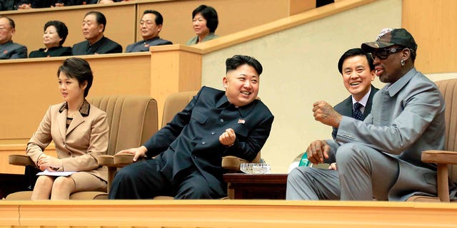 North Korea leader Kim Jong-un, second from left, watches a basketball game between former NBA players and North Koreans with NBA legend Dennis Rodman, right, at Pyongyang Indoor Stadium in Pyongyang, North Korea, on Jan. 9, 2014.