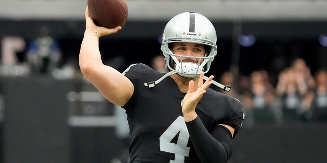 Las Vegas Raiders quarterback Derek Carr warms up before a preseason game Aug. 14, 2022, in Las Vegas.