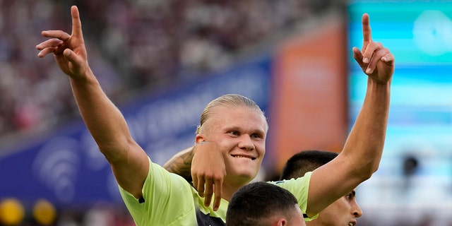 Manchester City's Erling Haaland celebrates after scoring his second goal of the game during the English Premier League match against West Ham United at London Stadium in London, England, Aug. 7, 2022.