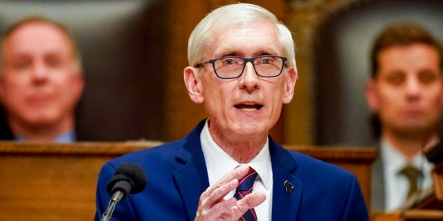 Wisconsin Gov. Tony Evers addresses a joint session of the Legislature in the Assembly chambers at the state Capitol in Madison, Wis. on Feb. 15, 2022.  