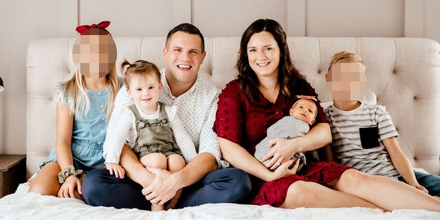 A family portrait of Jared and Kirsten Bridegan with their children.