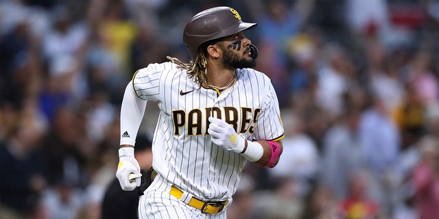 Tatis watches his solo home run off Cincinnati Reds starting pitcher Wade Miley during the sixth inning of a baseball game in San Diego on June 17, 2021.