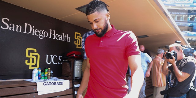 San Diego Padres' Fernando Tatis Jr. leaves a press conference where he talked about his 80-game suspension from baseball, Aug. 23, 2022, in San Diego, California.