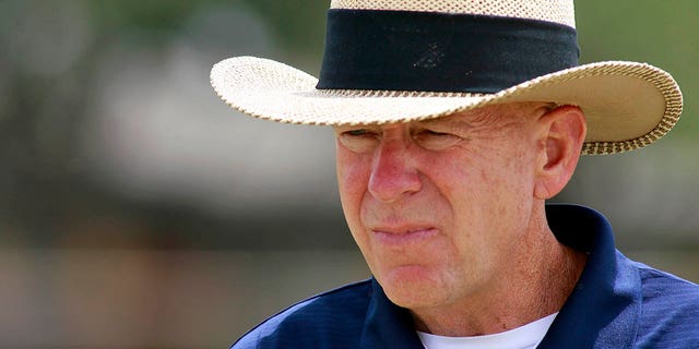 Coach Gary Gaines walks off the practice field after a workout in Odessa, Texas, May 21, 2009.