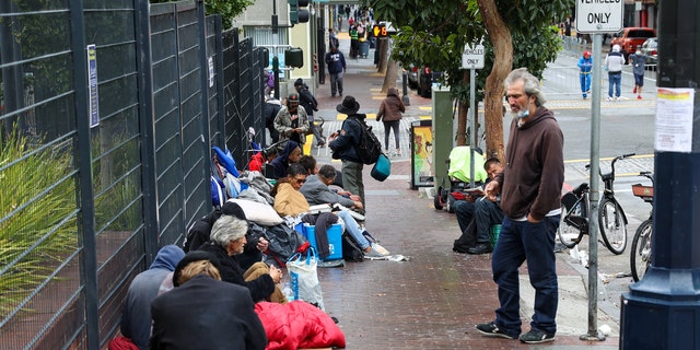 Homeless people are seen on streets of the Tenderloin district in San Francisco, California, United States on October 30, 2021.