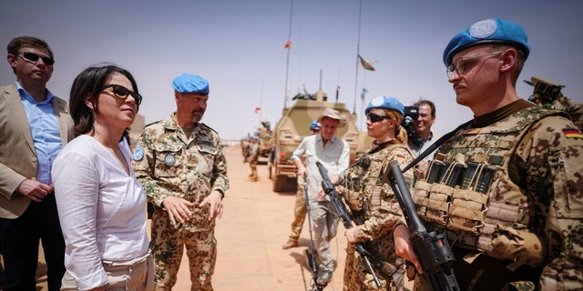 Annalena Baerbock, Germany's foreign minister, talks to soldiers at Camp Castor in Gao, Mali, where the German military is involved in the U.N. mission. (Kay Nietfeld/picture alliance via Getty Images)