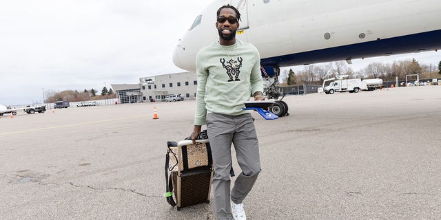 Patrick Beverley of the Timberwolves boards the plane before Game 5 of the playoffs against the Memphis Grizzlies at Minneapolis-St. Paul International Airport on April 25, 2022.