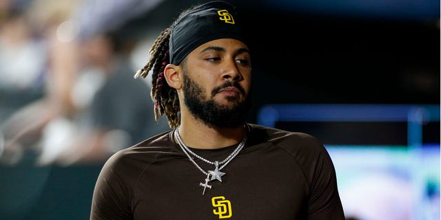 San Diego Padres shortstop Fernando Tatis Jr. (23) walks in the dugout during a game against the Colorado Rockies June 18, 2022, at Coors Field in Denver, Colo.