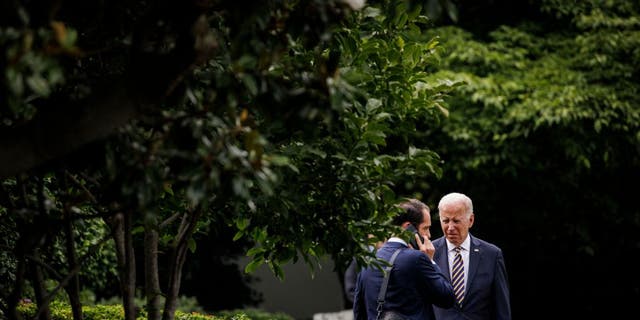 US President Joe Biden talks to Stephen Goepfert, Special Assistant and Personal Aide to the President, in the Jacqueline Kennedy Garden at the White House before boarding Marine One in Washington, DC, on July 6, 2022. - President Biden travels to Ohio to speak about the American Rescue Plan. SAMUEL CORUM/AFP via Getty Images)