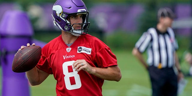 Minnesota Vikings quarterback Kirk Cousins looks to pass during the first day of training camp at TCO Performance Center in Eagan, Minnesota, on July 27, 2022.