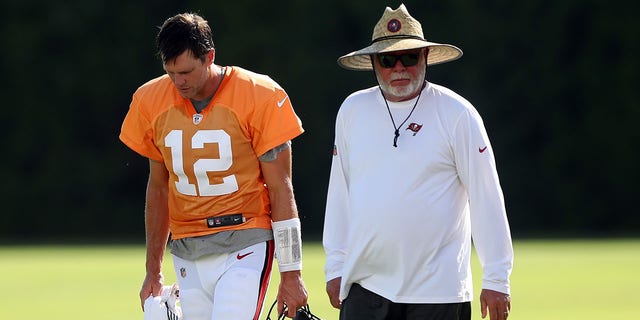 Tampa Bay Buccaneers quarterback Tom Brady (12) talks with senior adviser Bruce Arians during Tampa Bay Buccaneers training camp at AdventHealth Training Center in Tampa, Florida, on Aug. 2, 2022.