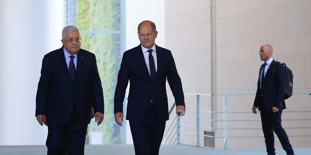 Olaf Scholz and Mahmoud Abbas arrive for a news conference in Berlin on Tuesday, Aug. 16, 2022. (Krisztian Bocsi/Bloomberg via Getty Images)