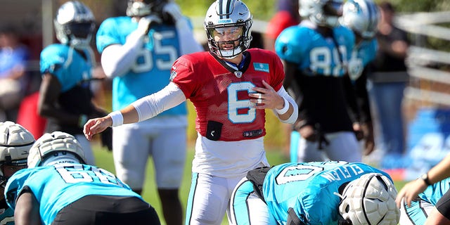 Carolina Panthers quarterback Baker Mayfield calls a play during practice.