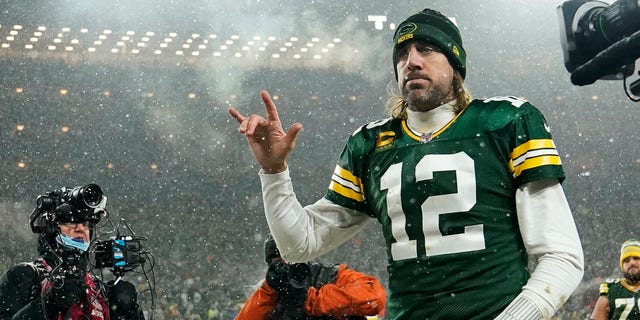 Quarterback Aaron Rodgers #12 of the Green Bay Packers gestures as he exits the field after losing the NFC Divisional Playoff game to the San Francisco 49ers at Lambeau Field on January 22, 2022, in Green Bay, Wisconsin. 