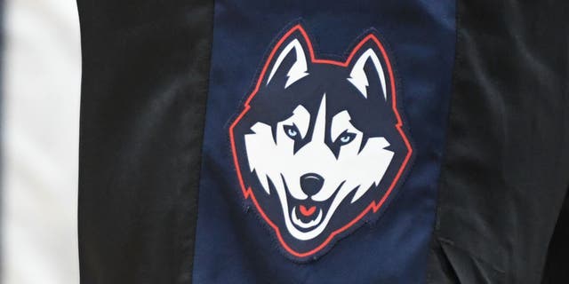 The Connecticut Huskies logo on a pair of shorts during a college basketball game at the Capital One Arena. UConn's defensive coordinator is taking a leave of absence.