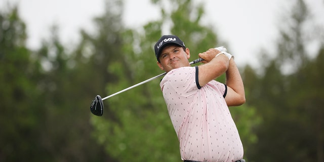 Patrick Reed, of 4 Aces GC, plays his shot from the 15th tee during day one of the LIV Golf Invitational - Bedminster at Trump National Golf Club Bedminster on July 29, 2022 in Bedminster, New Jersey. 