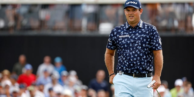 Patrick Reed walks across the tenth green during day three of the LIV Golf Invitational - Bedminster at Trump National Golf Club in Bedminster, New Jersey, on July 31, 2022.