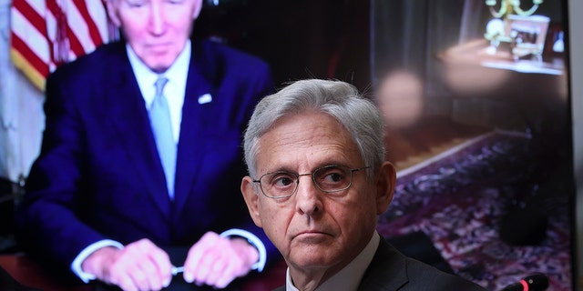 As President Joe Biden, appearing via teleconference, looks on Attorney General Merrick Garland attends a meeting of the Task Force on Reproductive Healthcare Access during an event at the White House complex August 3, 2022.