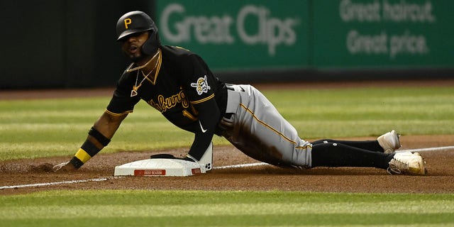 Rodolfo Castro of the Pittsburgh Pirates slides into third against the Arizona Diamondbacks on Aug. 9, 2022, in Phoenix.