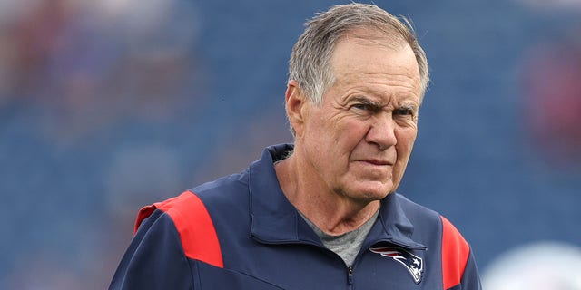 Head coach Bill Belichick of the New England Patriots looks on ahead of the preseason game between the New York Giants and the New England Patriots at Gillette Stadium on August 11, 2022 in Foxborough, Massachusetts. 