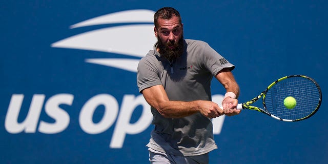 Benoit Paire of France plays a backhand against Cameron Norrie of Great Britain during the men's singles first round of the 2022 U.S. Open at USTA Billie Jean King National Tennis Center Aug. 30, 2022, in New York City. 