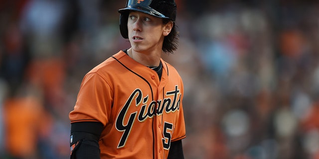 Tim Lincecum, #55 of the San Francisco Giants, looks back at the scoreboard as he walks back to the dugout in the bottom of the second inning against the Arizona Diamondbacks at AT&amp;T Park on July 11, 2014 in San Francisco.  