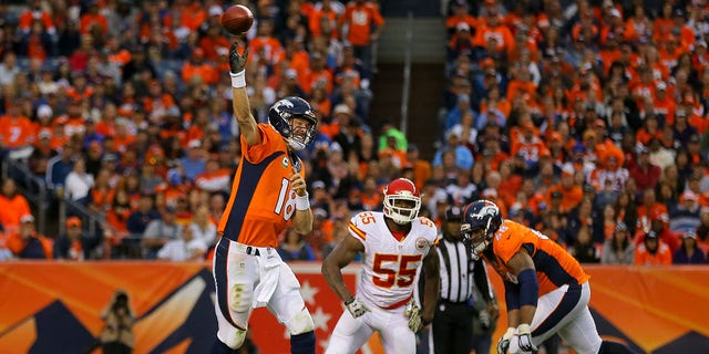 Quarterback Peyton Manning of the Denver Broncos throws a pass in front of his offensive tackle Ryan Harris and Kansas City Chiefs linebacker Dee Ford at Sports Authority Field at Mile High in Denver, Colorado, on Nov. 15, 2015.