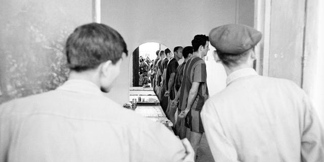 American POW soldiers inside their jail cell at the Hanoi Hilton prior to their release in 1973 in Hanoi, Vietnam.  