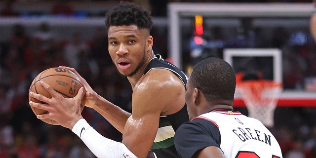 Giannis Antetokounmpo, #34 of the Milwaukee Bucks, looks to pass against Javonte Green, #24 of the Chicago Bulls, during Game Four of the Eastern Conference First Round Playoffs at the United Center on April 24, 2022 in Chicago.