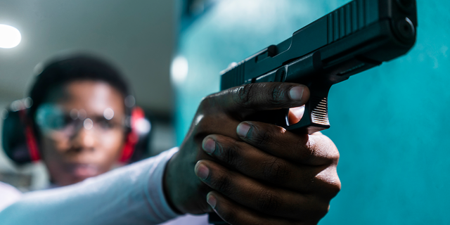 Woman at shooting range